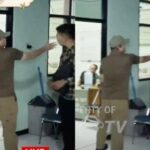 pria-berbaju-cokelat-menampar-pemuda-berkemeja-kotak-kotak-di-lokasi-gudang-peluru